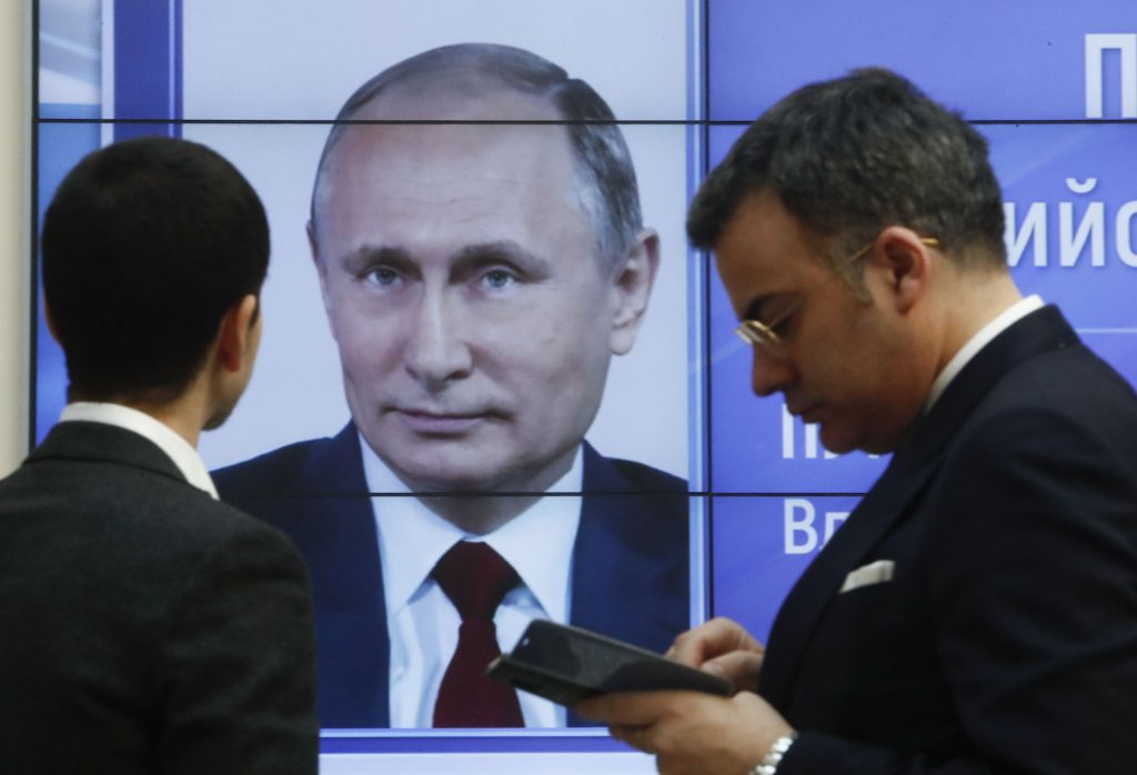 A screen showing preliminary results in Russia's 2018 presidential election. Photo credit: REUTERS/Sergei Karpukhin