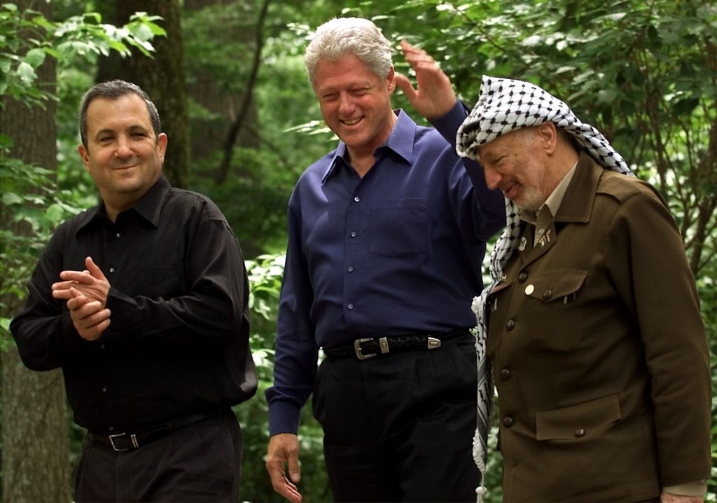 Bill Clinton walks with Israeli Prime Minister Ehud Barak and Palestinian President Yasser Arafat on the grounds of Camp David during peace talks, in 2000. Photo credit: WM/RCS