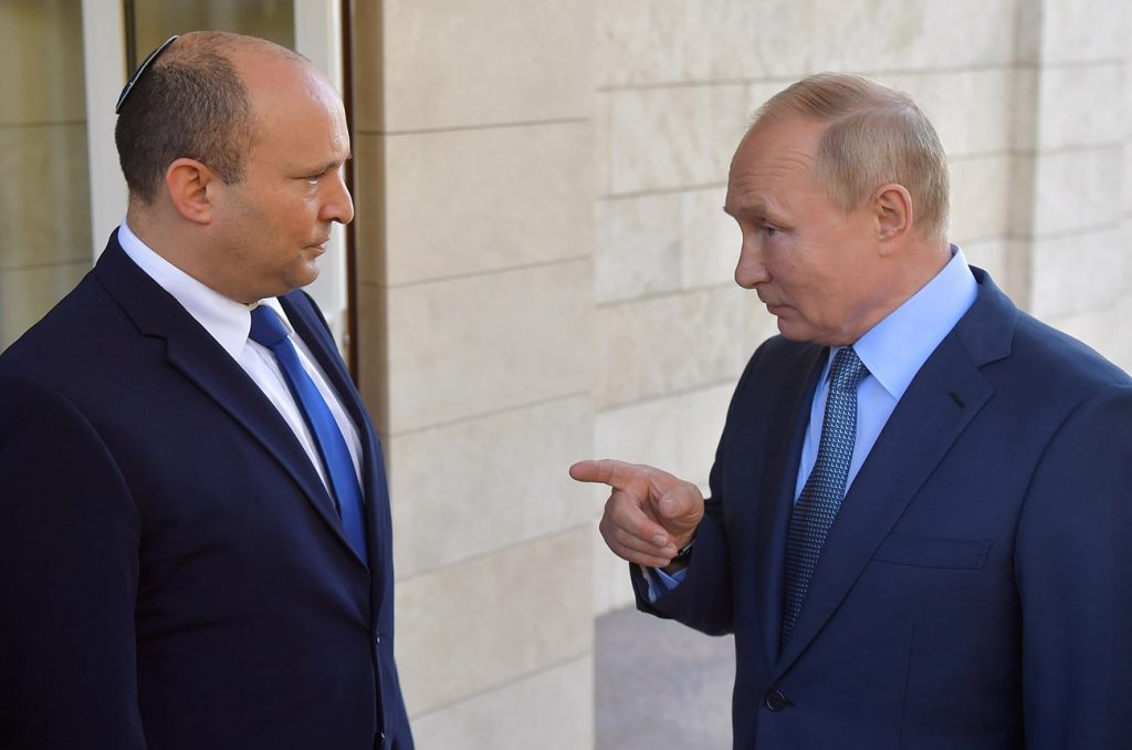 Russian President Vladimir Putin talks to Israeli Prime Minister Naftali Bennett during their meeting in Sochi, Russia. Photo credit: REUTERS.