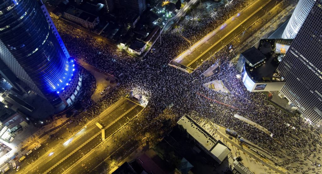 People protest against the proposed judicial reforms, in Tel Aviv, Israel, February 25, 2023. Photo credit: REUTERS