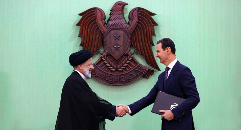 Iran's President Ebrahim Raisi meets with Syria's President Bashar al-Assad in Damascus, May 2023. Photo credit: IMAGO/APAimages via Reuters Connect