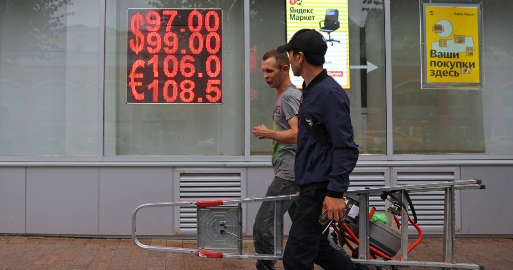 A board showing currency exchange rates of the US dollar and euro against Russian rouble in a street in Moscow, August 2023. Photo credit: REUTERS/Evgenia Novozhenina