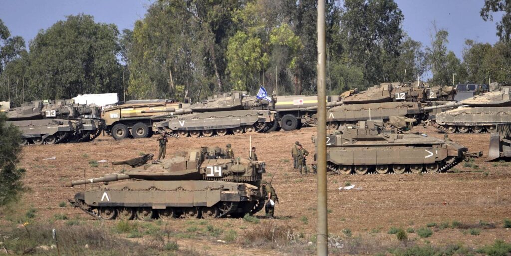 Israeli tanks gather near the Gaza border, October 11, 2023. Photo credit: Toshiyuki Fukushima / The Yomiuri Shimbun via Reuters Connect