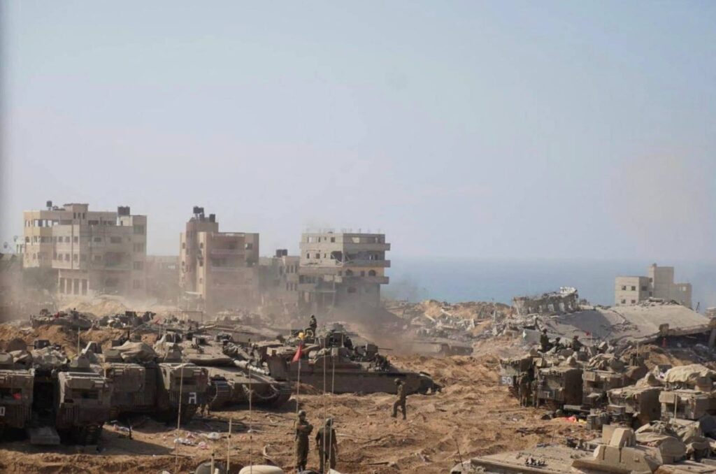 Israeli soldiers and tanks take position inside the Gaza Strip, November 5, 2023. Photo credit: IDF/Handout via REUTERS.