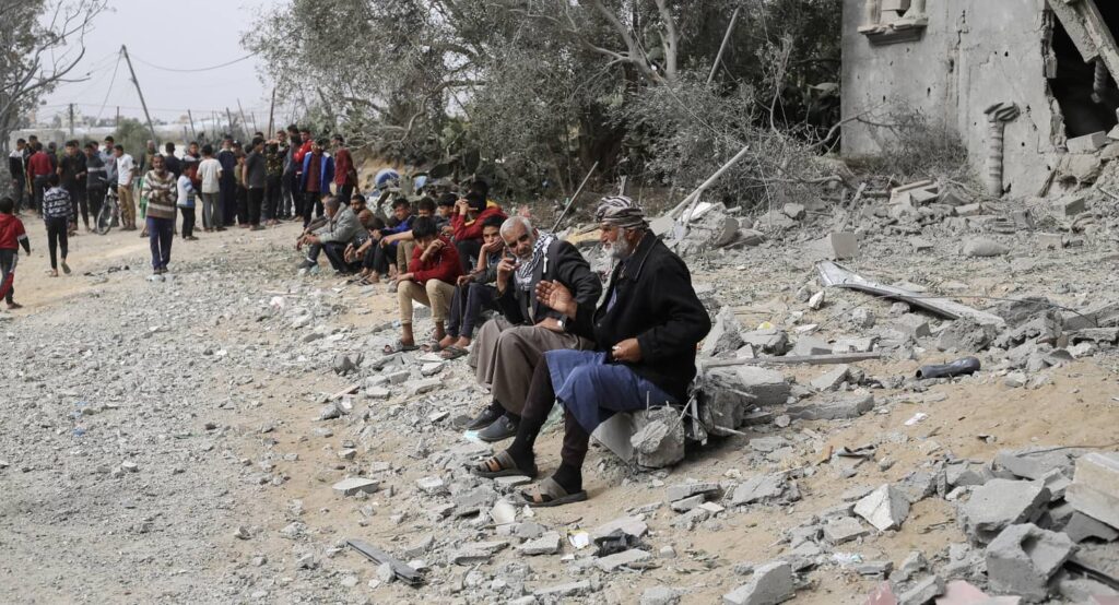 Gazans gather at the site of an Israeli airstrike in Khan Younis, March 29, 2024. Photo credit: REUTERS/Ahmed Zakot.