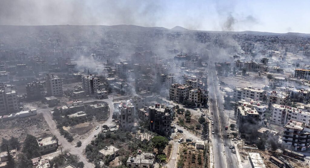 An aerial of al-Suwayda, amid clashes between tribal fighters and local Druze factions, July 2025. Photo credit: Moawia Atrash/dpa via Reuters Connect.